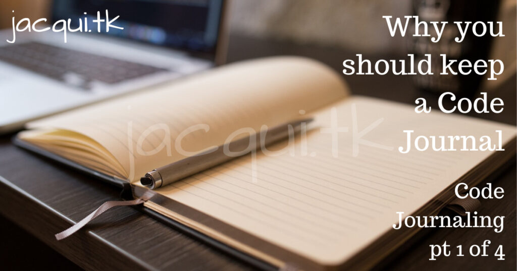 notebook with pen next to laptop